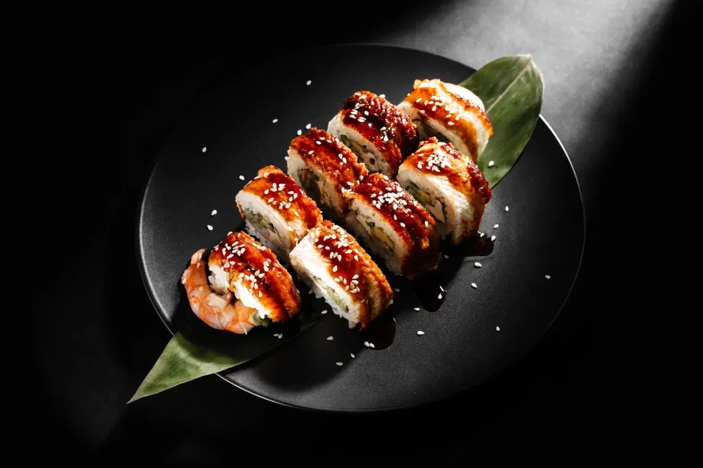 apanese-sushi-rolls-with-salmon-shrimp-smoked-eel-red-caviar-1024x683.webp